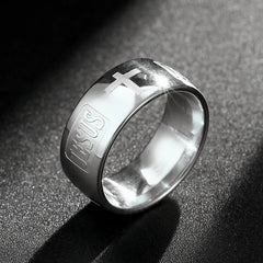 A polished silver-tone titanium steel ring featuring an engraved cross and the word Jesus.