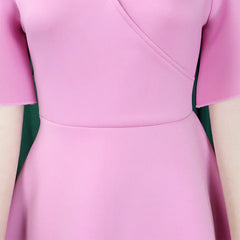 A close-up of a solid pink V-neck dress with short butterfly sleeves and a high-waisted fit.