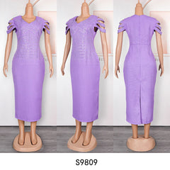 A lavender midi dress with a V-neck, embellished bodice, and cut-out sleeve details.