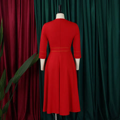 A red mid-calf A-line dress with three-quarter sleeves and a high waist on a mannequin.