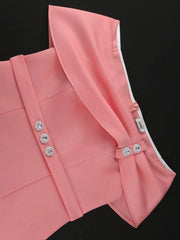 A pink off-shoulder midi dress featuring decorative rhinestone buttons on the bodice.