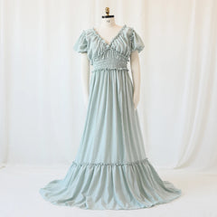 A sage green bohemian maternity maxi dress with a V-neck, ruffled sleeves, and a smocked waist.
