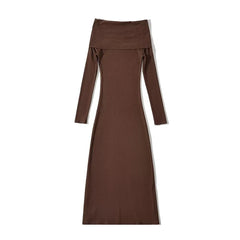 A long-sleeved, ankle-length brown knit maternity dress with an off-the-shoulder neckline.