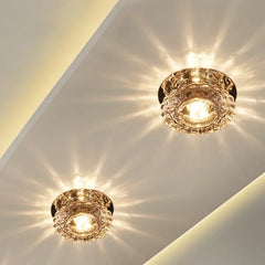 Two modern crystal lotus-shaped LED ceiling lights mounted on a white ceiling.