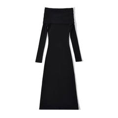 A black off-shoulder ankle-length maternity knit dress with long sleeves.