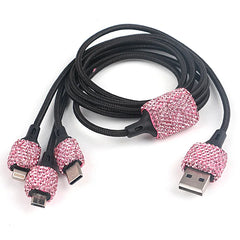 A multi-connector charging cable featuring black braided cords and pink rhinestone accents.