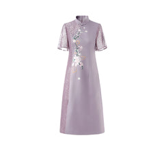 A purple A-line cheongsam dress featuring short lace sleeves, a stand-up collar, and floral embroidery.