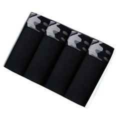 A set of four black cotton boxer shorts with grey camouflage patterned waistbands in a box.