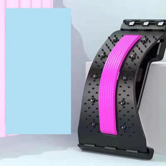A black adjustable back stretcher with a pink lumbar support strip and magnetic massage points.