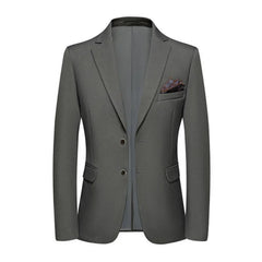 A slim-fit grey men's blazer with a two-button closure and a pocket square.