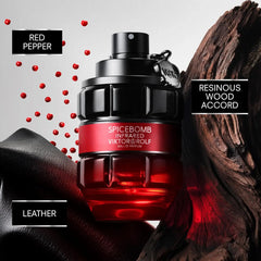 Viktor and Rolf Spicebomb Infrared Eau de Parfum bottle surrounded by red pepper, wood, and leather.