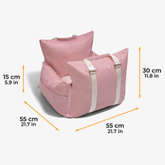 A pink waterproof pet car seat with white straps and dimensions labeled in centimeters and inches.