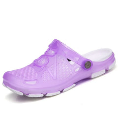 A purple jelly sandal with a white sole and a pivoting back strap.