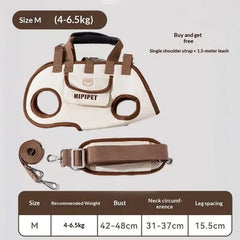 A cream and brown pet carrier bag with a harness design and an included shoulder strap.