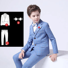 A boy wears a blue plaid formal suit with a matching vest, trousers, and a bow tie.