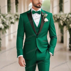 A man wears a three-piece emerald green suit with a black shawl collar and a matching bow tie.