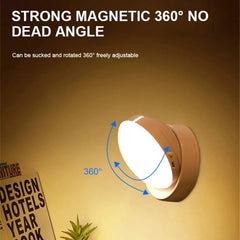 A round, wood-toned motion sensor night light is mounted on a wall, showing its 360-degree rotation.