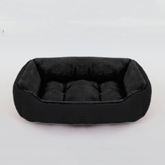 A black rectangular plush pet bed with raised sides on a white background.