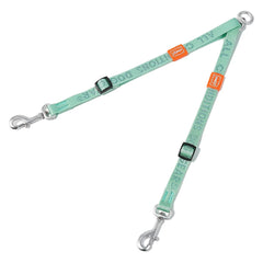 A mint green nylon double dog leash with adjustable straps and two metal swivel clips.
