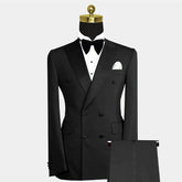 A black double-breasted tuxedo suit with a peak lapel, white shirt, and bow tie.