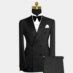 A black double-breasted tuxedo suit with a peak lapel, white shirt, and bow tie.