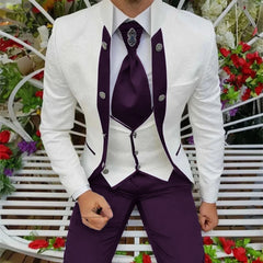 A man wears a white patterned tuxedo jacket with purple lapels, a white vest, and purple trousers.