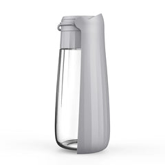 A grey portable dog water bottle with an integrated foldable drinking bowl.