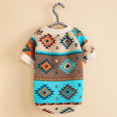 A khaki and turquoise dog sweater featuring a retro geometric totem print and ribbed trim.