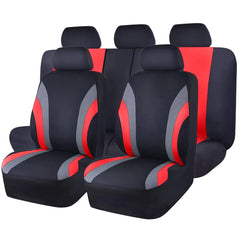 A full set of black, red, and grey polyester car seat covers with a universal sports design.