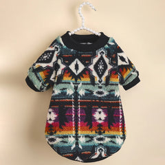 A cozy, fleece-lined dog sweater featuring a colorful, retro-inspired geometric totem print.