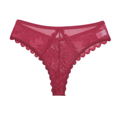 A red low-rise thong made of floral lace with a scalloped edge and sheer mesh panels.