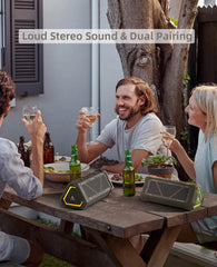 Two MLOVE P3 triangular outdoor Bluetooth speakers with RGB lighting sit on a wooden table.
