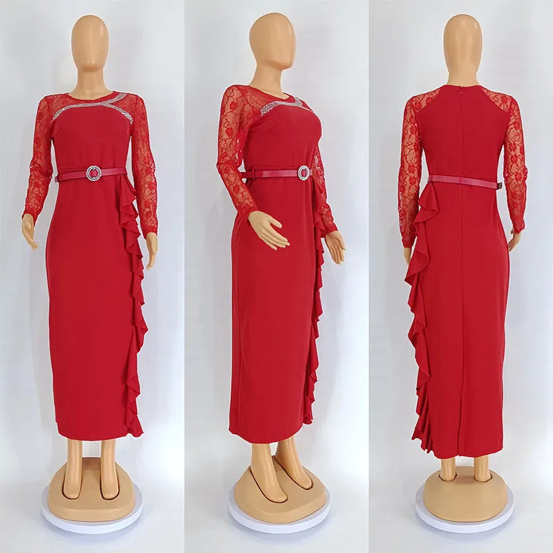 A red long-sleeved midi dress with lace sleeves, a belted waist, and a ruffled side detail.
