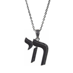 A black copper pendant necklace featuring the Hebrew letter Chai encrusted with black zircon stones.