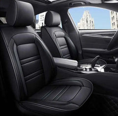 Black PU leather car seat covers with a stitched design installed on front seats.