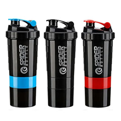 Three black shaker bottles with blue, black, and red accents standing in a row.