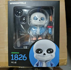 A boxed Undertale Sans action figure with interchangeable accessories and a display window.