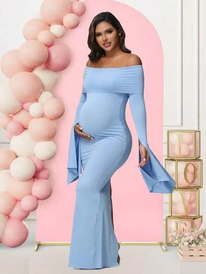 A pregnant woman wears a light blue off-shoulder long-sleeve mermaid maternity dress.