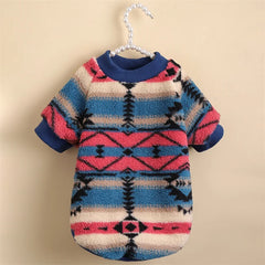 A cozy, fleece-lined dog sweater featuring a colorful, retro-inspired geometric print.