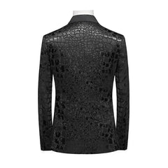 A black double-breasted men's suit jacket featuring a textured crocodile-skin pattern.