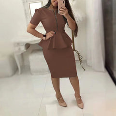 A woman wears a brown two-piece set featuring a v-neck peplum top with a zipper and a pencil skirt.