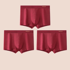 Three pairs of solid red cotton boxer briefs with a U-pouch design and branded waistbands.