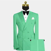 A mint green double-breasted two-piece suit with a peak lapel, white shirt, and black bow tie.