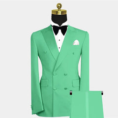A mint green double-breasted two-piece suit with a peak lapel, white shirt, and black bow tie.