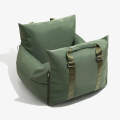 An olive green waterproof pet car seat with adjustable straps and a removable cover.