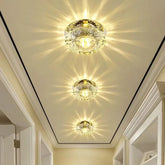 Three round, crystal-style LED ceiling lights are embedded in a white hallway ceiling.
