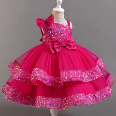 A sleeveless fuchsia ball gown dress for girls featuring sequin embellishments and large bows.
