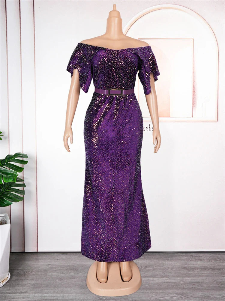 A floor-length purple sequin mermaid dress with petal sleeves and a matching belt.