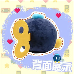 A plush Bob-omb tissue box from Super Mario Bros with a dark blue body and yellow wind-up key.
