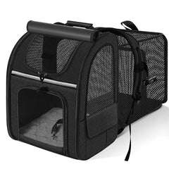 A black expandable pet carrier backpack with breathable mesh panels and a top handle.
